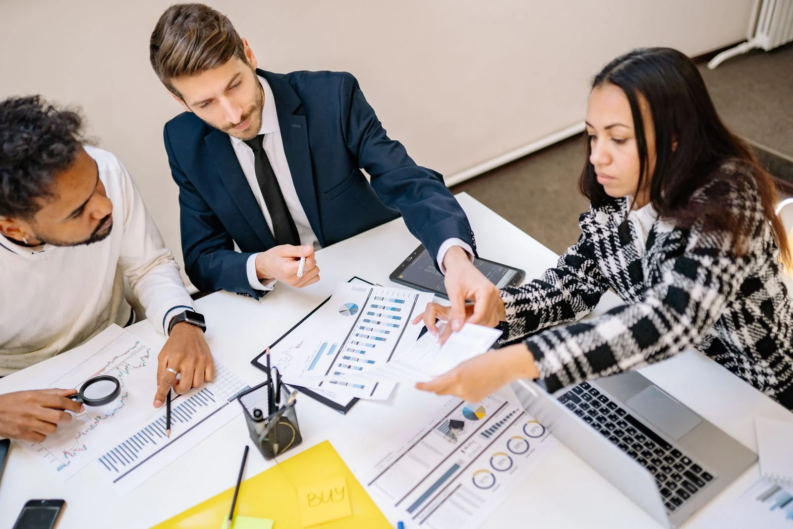 Business professionals reviewing operational plans together