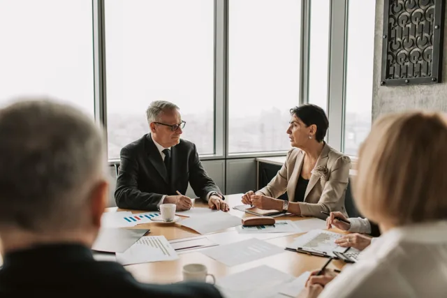 Business professionals discussing organizational supply planning