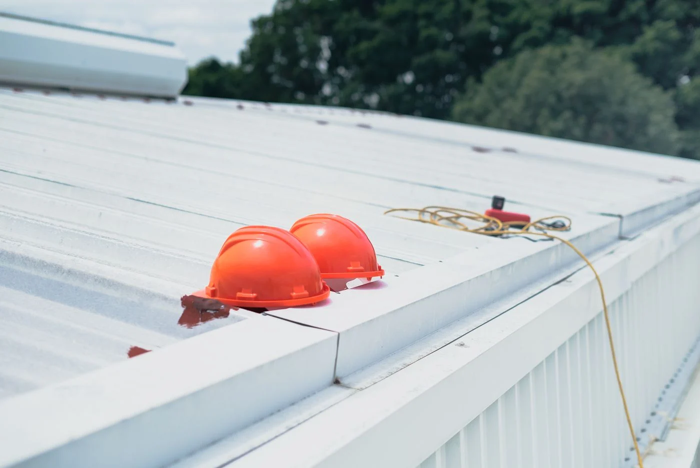 Protective hard hats laid out at a worksite
